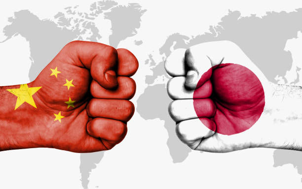 Conflict between China and Japan, male fists - governments conflict concept
